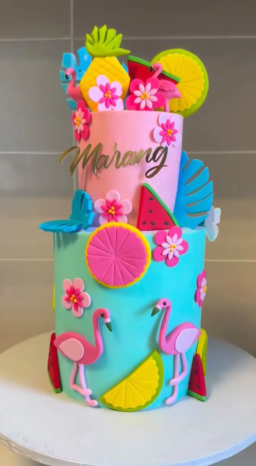 Baker carefully decorating cakes in a professional kitchen